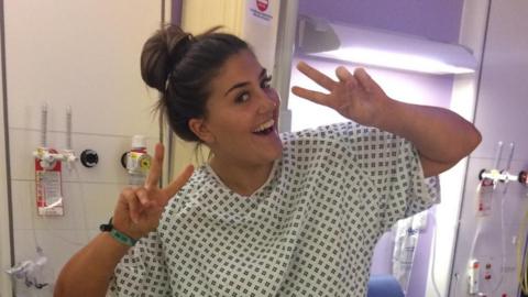 Georgia Edwards in a hospital gown before having surgery for her melanoma