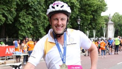 Image of Andy Stammers after a charity bike challenge