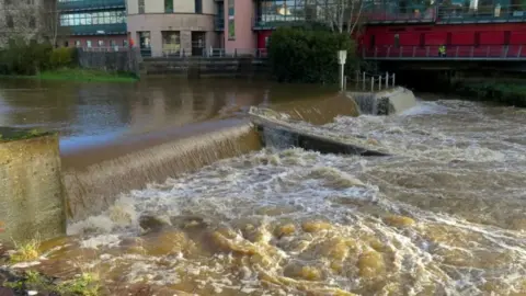 MAIB The weir in Haverfordwest, where the paddleboarders got into trouble. An image of fast-flowing water in a river beneath the weir.