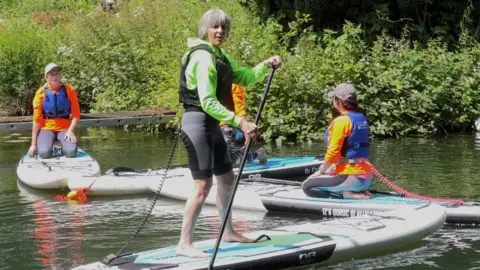 Tara Crist on paddle-board 