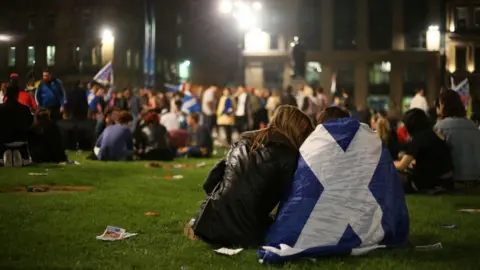 PA Media Yes campaigners in George Square await the results of the 2014 independence referendum 