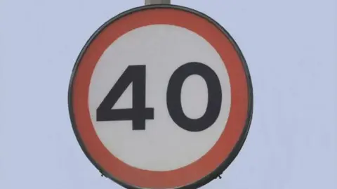 A picture of a 40 mile per hour speed limit. It is a white sign with a red circle around it.