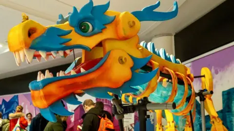 Trevor Sewell/Leicester Media Orange and blue dragon