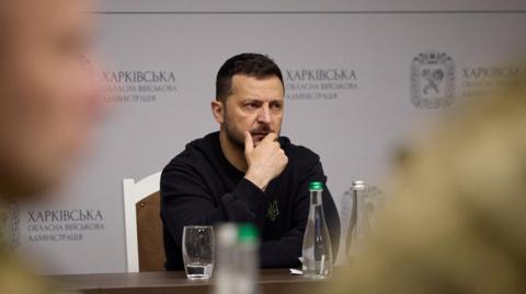 Ukraine's President Volodymyr Zelensky at a meeting with top military officials as he visits Kharkiv region, 16 May 2024