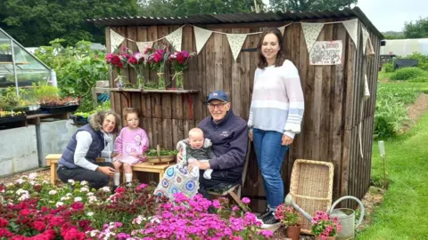 Heather Playfoot The Playfoot family outside their Four Generation Shed