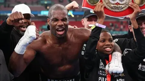 Daniel Dubois celebrates with his family