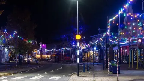 Alan Harrison A street in Portishead town centre covered in Christmas lights.