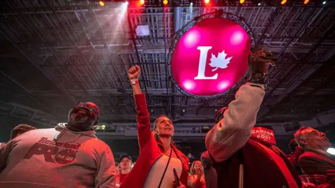 Getty Images Supporters react at an election night event for Canadian Prime Minister and Liberal Party leader Mark Carney.