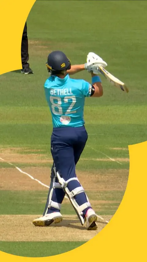Jacob Bethell hitting a six