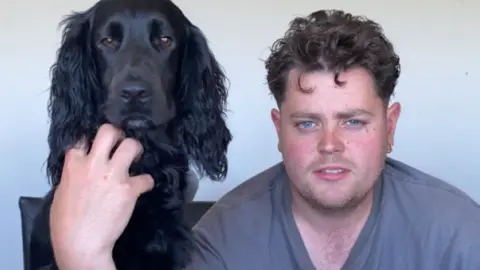 Family photograph  Macauley Owen with his dog