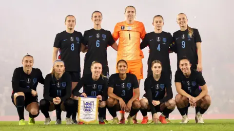 PA Media Left to right, back to front: England's Lucia Kendall, Lotte Wubben-Moy, goalkeeper Anna Moorhouse, Kiera Walsh, Aggie Beever-Jones, Lucy Bronze, Chloe Kelly, Missy Bo Kearns, Taylor Hinds, Jess Park and Maya Le Tissier before the women's international friendly at St Mary's Stadium, Southampton. 