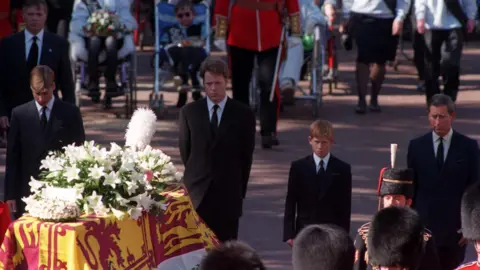 PA Media Princes William, Earl Spencer, Prince Harry and the then Prince of Wales, walking behind Princess Diana's coffin as the funeral procession approaches Westminster Abbey in September 1997