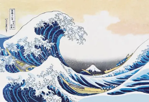 Getty Images Hokusai's The Great Wave off Kanagawa. A painting of a large blue wave with white seafoam. A snow-capped mountain sits in the background.