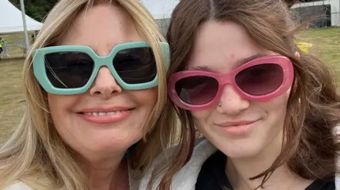 Woman and young woman wearing colourful glasses