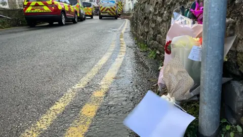 Flowers at the scene of a fire in St Dogmaels