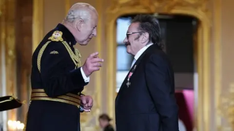 PA Media Actor Paul Elliott talks to King Charles III