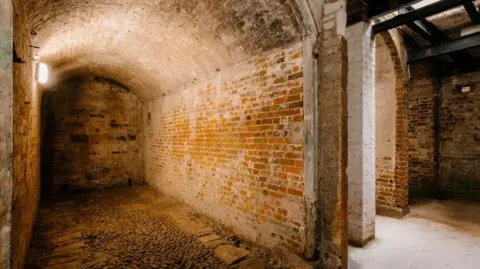 Euan Baker An underground brick cellar. 