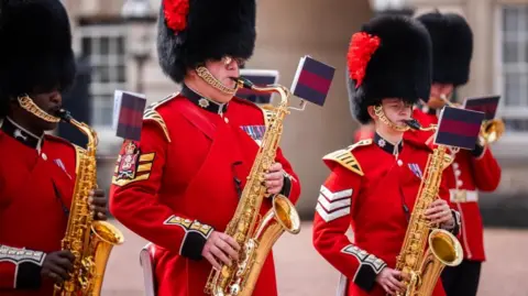 Palace guards play saxophone.