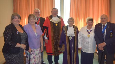 The Lord Mayor, Councillor Mark Shayer and Deputy Lord Mayor, Councillor Kathy Watkin photographed alongside Basil Downing-Waite, Vice President and Councillor Pauline Murphy, President of the Association (R) and the Chair and members of the Association (L)