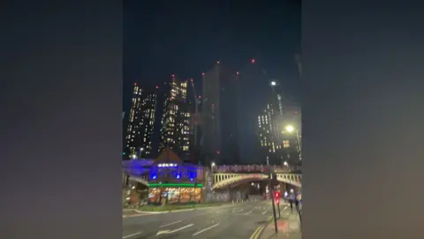 Tom Walker/BBC Shot of Deansgate with blacked out West Tower (right)
