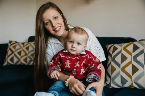 Caroline Briggs/BBC Emily Terrell and Archie