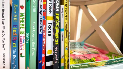 DOLLYWOOD FOUNDATION A close-up of children's books which includes where is the hungry caterpillar.