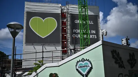 memorial wall , green heart, tower block, with scaffolding