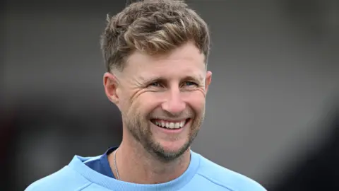 England Test captain Joe Root smiles