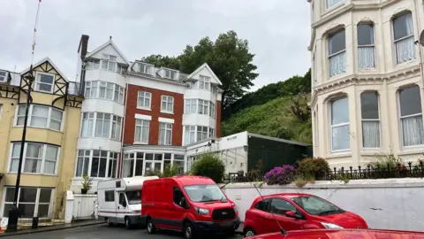 The white and red frontage of Seaview Hotel, Douglas, Isle of Man