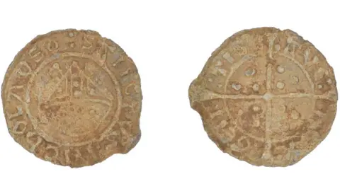 Suffolk County Council Two views of a lead token found by a detectorist in 2019 in Bury St Edmunds. On the left it shows a bishop's mitre in the middle with Sanctus Nicholas written in Latin; the right it shows a cross with three dots within each arm section and Ave Rex Gentis around its circumference 