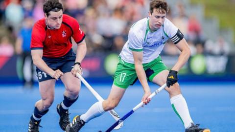 Great Britain’s Henry Croft challenges Ireland’s Sean Murray during Pro League encounter