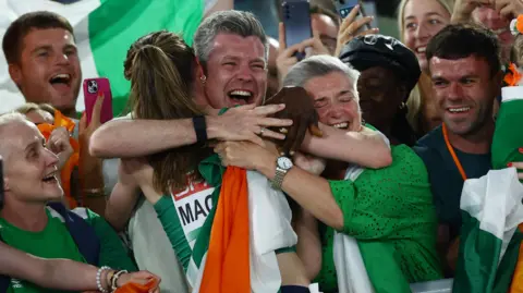 Mageean is congratulated by her supporters in Rome after her victory