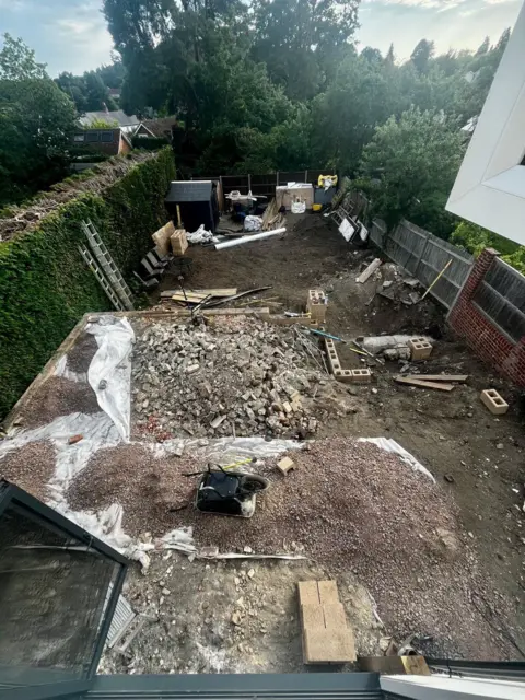 Supplied A garden that looks like a building site. 