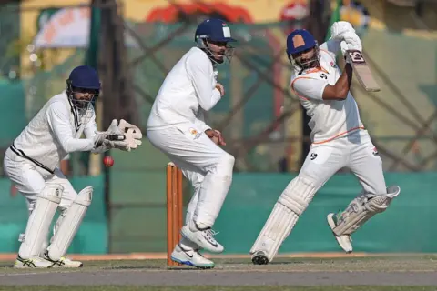 Hindustan Times via Getty Images SRINAGAR, INDIA - OCTOBER 16: Paras Dogra of Jammu and Kashmir during Ranji Trophy match aganist Mumbai at Sher-I-Kashmir Stadium on October 16, 2025 in Srinagar, India.(Photo by Waseem Andrabi/Hindustan Times via Getty Images)