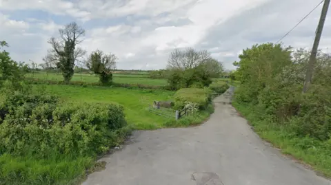 A google street view shot from the A361 looking over hedgerows and fields near Frome in Somerset