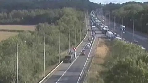 National Highways Queues on the motorway and sliproad