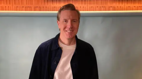 BBC Patrick smiling in the studio as a guest on Ready to Talk