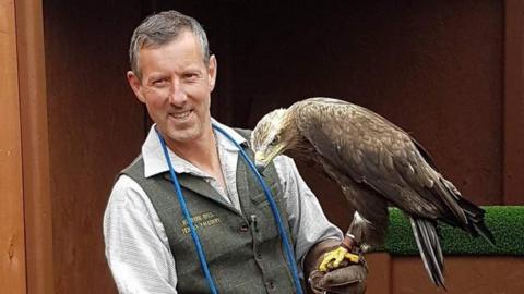 Richard Hall with his eagle Hemlock