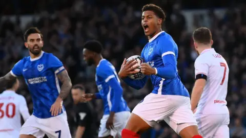 Kusini Yengi celebrates with Portsmouth