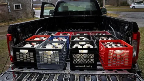Getty Images Jugs of freshly bottled raw milk at a farm in the US