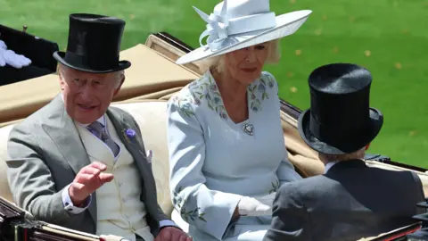NEIL HALL/EPA/Shutterstock King Charles III and Queen Camilla arrive in a carriage on the first day of Royal Ascot.
