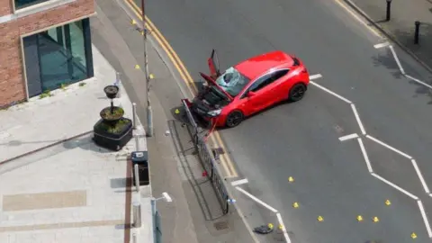 PA Media Aerial view of car wreckage