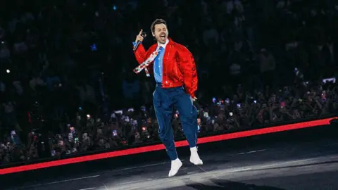 Harry Styles performs on stage during his Together, Together Tour.