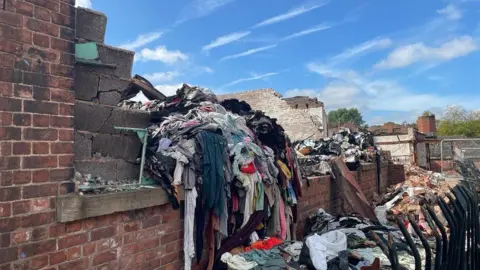 A building and clothes damaged by blaze.