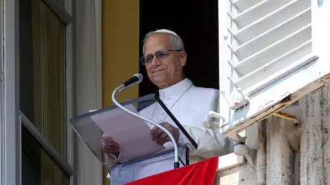 Reuters, Pope Liu, the fourteenth, leads Angelos prayer from his window in the Vatican