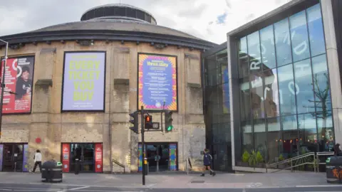 Getty Images An external image of the Roundhouse. A cylindrical building with a glass extension.