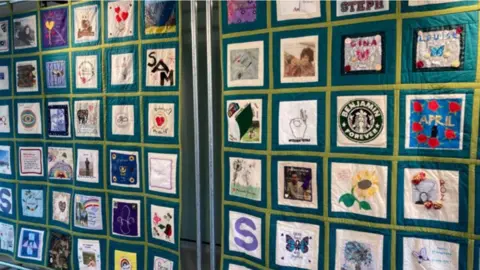 A close up shot of squares on a memorial quilt made in Hampshire