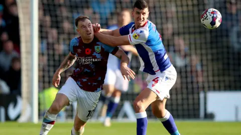 PA Media Burnley’s Ashley Barnes battles with Blackburn Rovers' Daniel Ayala 