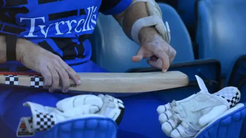 Getty Images Kane Williamson of London Spirit checks his bat before the The Hundred match between Oval Invincibles Men and London Spirit Men at The Kia Oval on August 25, 2025 in London, England. 