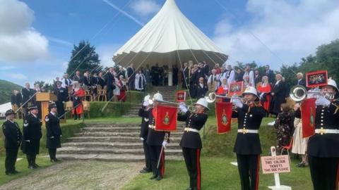 Politicians, dignitaries, the judiciary and the clergy gathering on Tynwald Hill